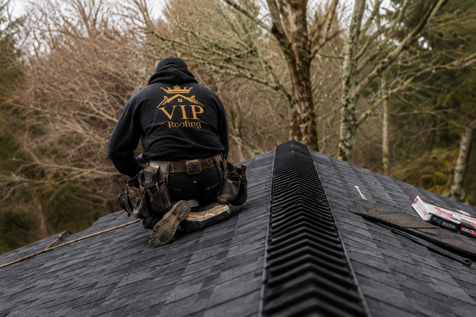 VIP Roofing crewman finishing a roof ridge cap
